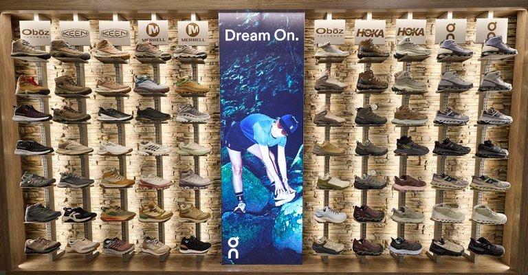 display of different styles of hiking shoes and boots